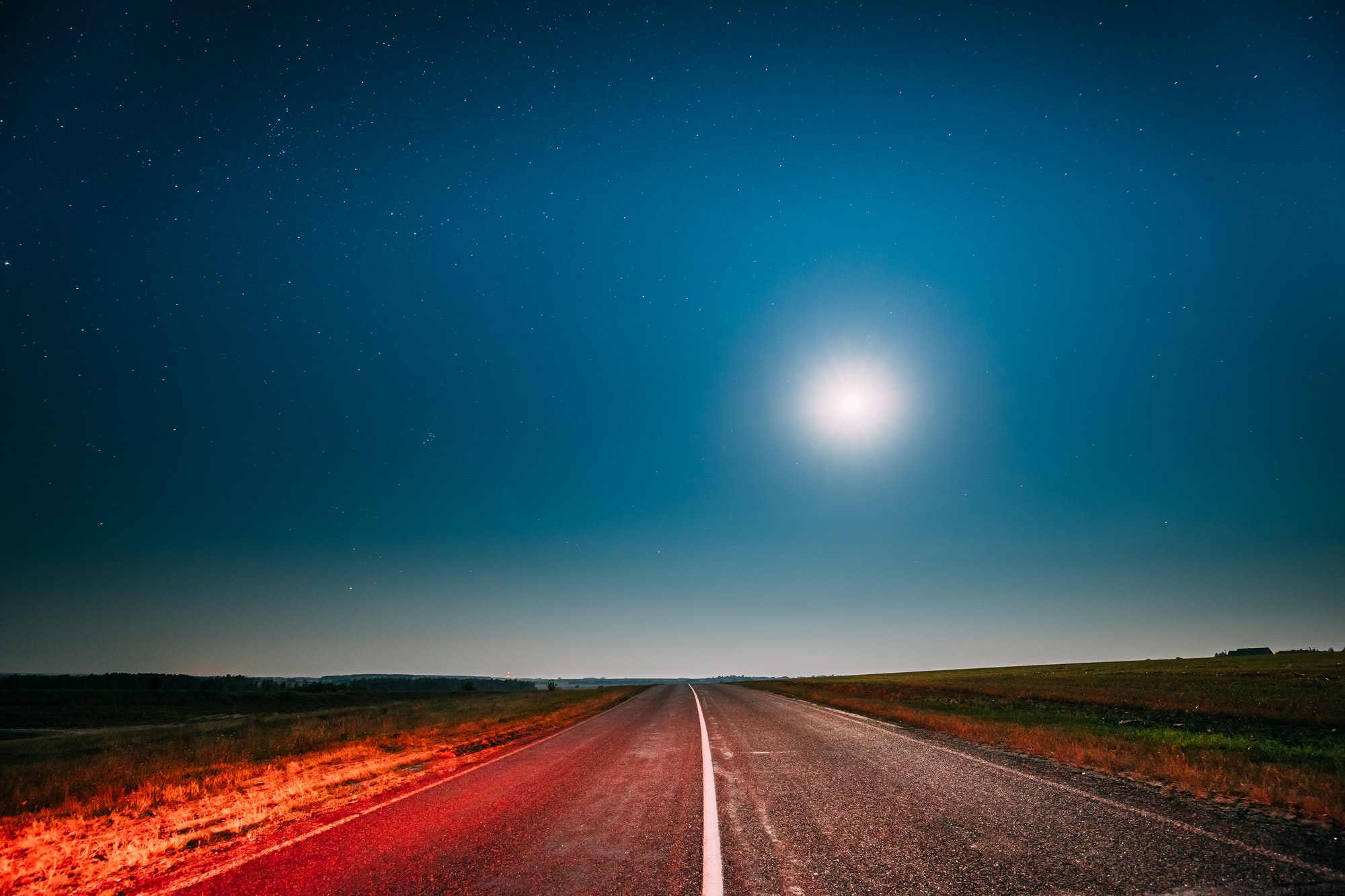Night Starry Sky With Moon Above Country Asphalt Road In Country